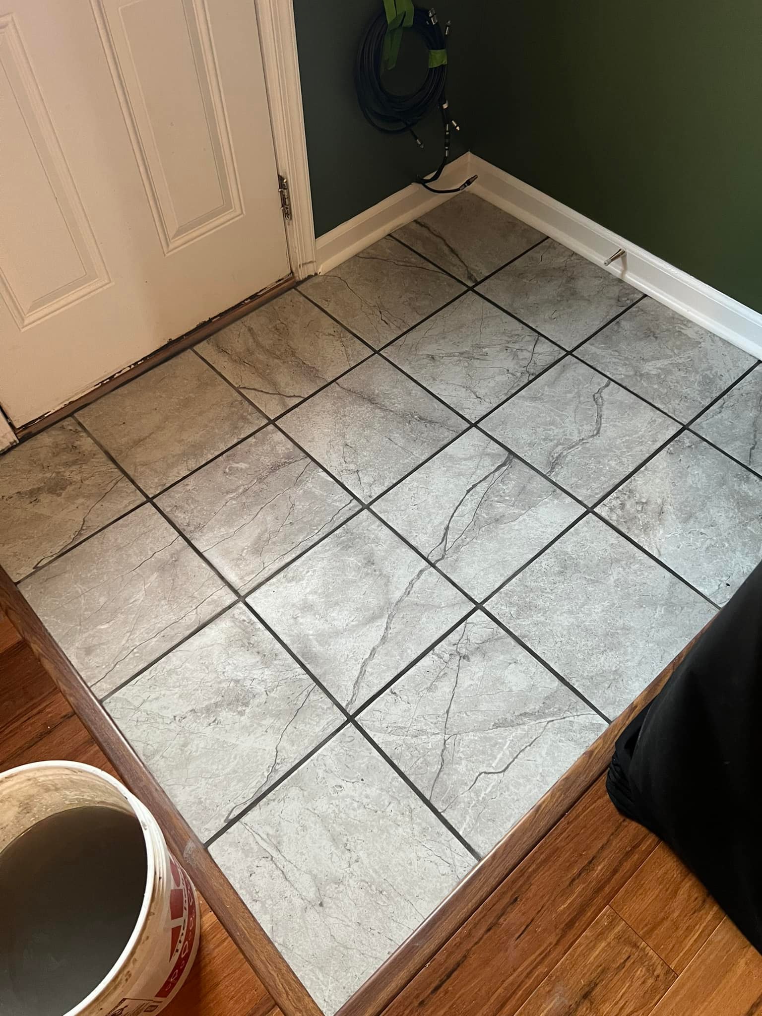 Entryway Tile With Wood Floor Surround